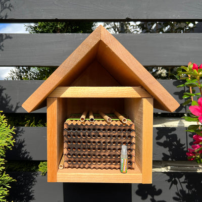A wooden leafcutter bee house designed for use with InvitaBee Attractant