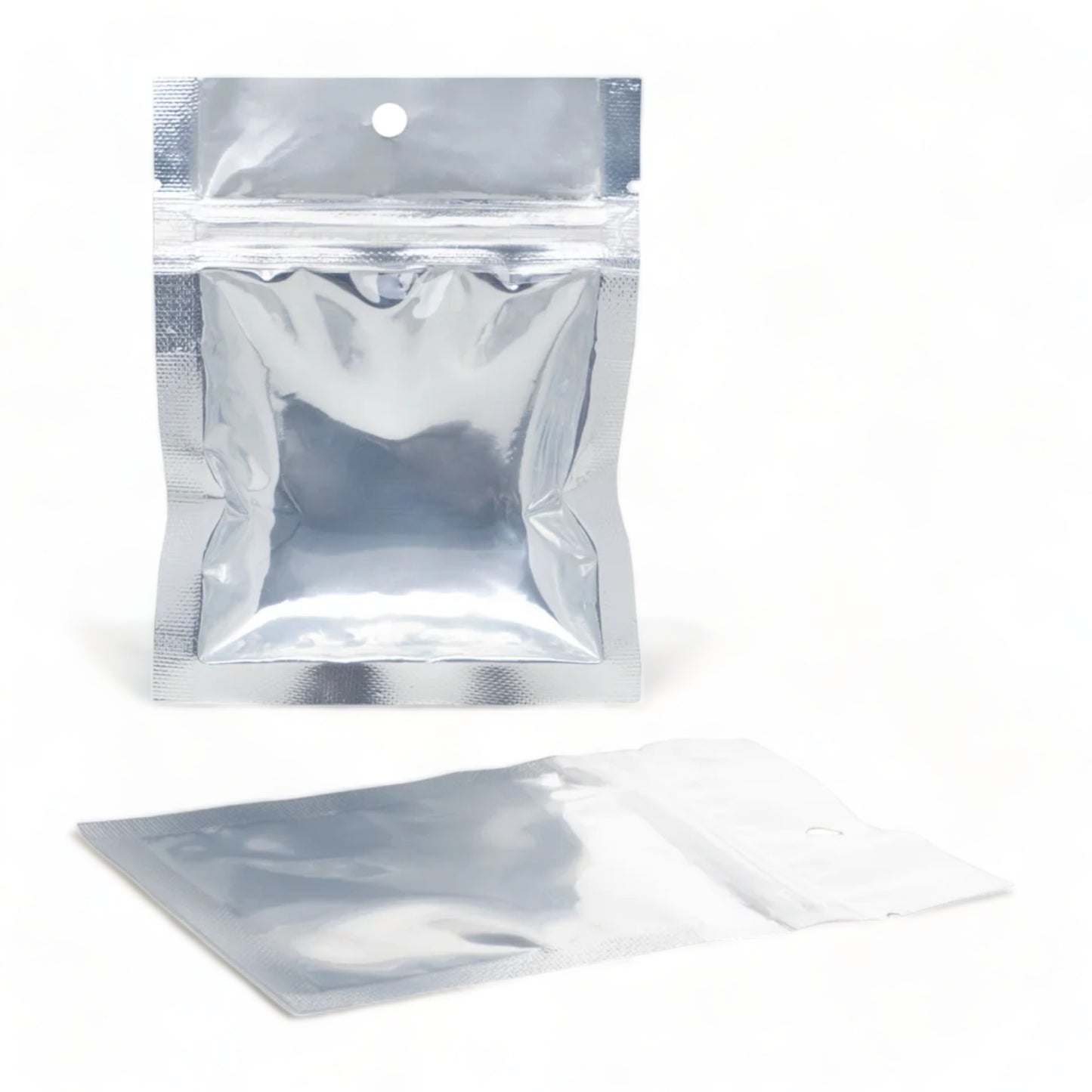Two individual empty seed saving packet with a resealable zipper
