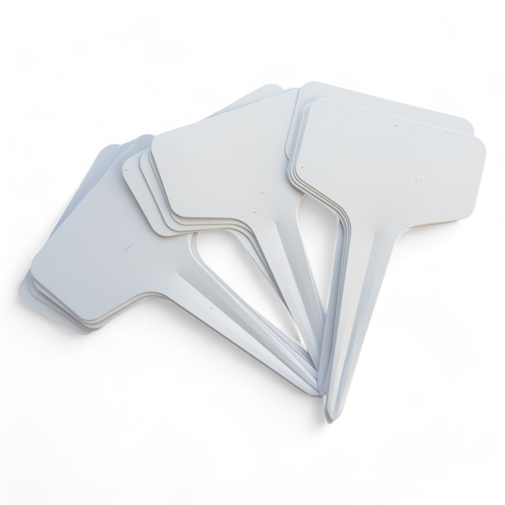 A bundle of white garden stakes for plant identification and labeling
