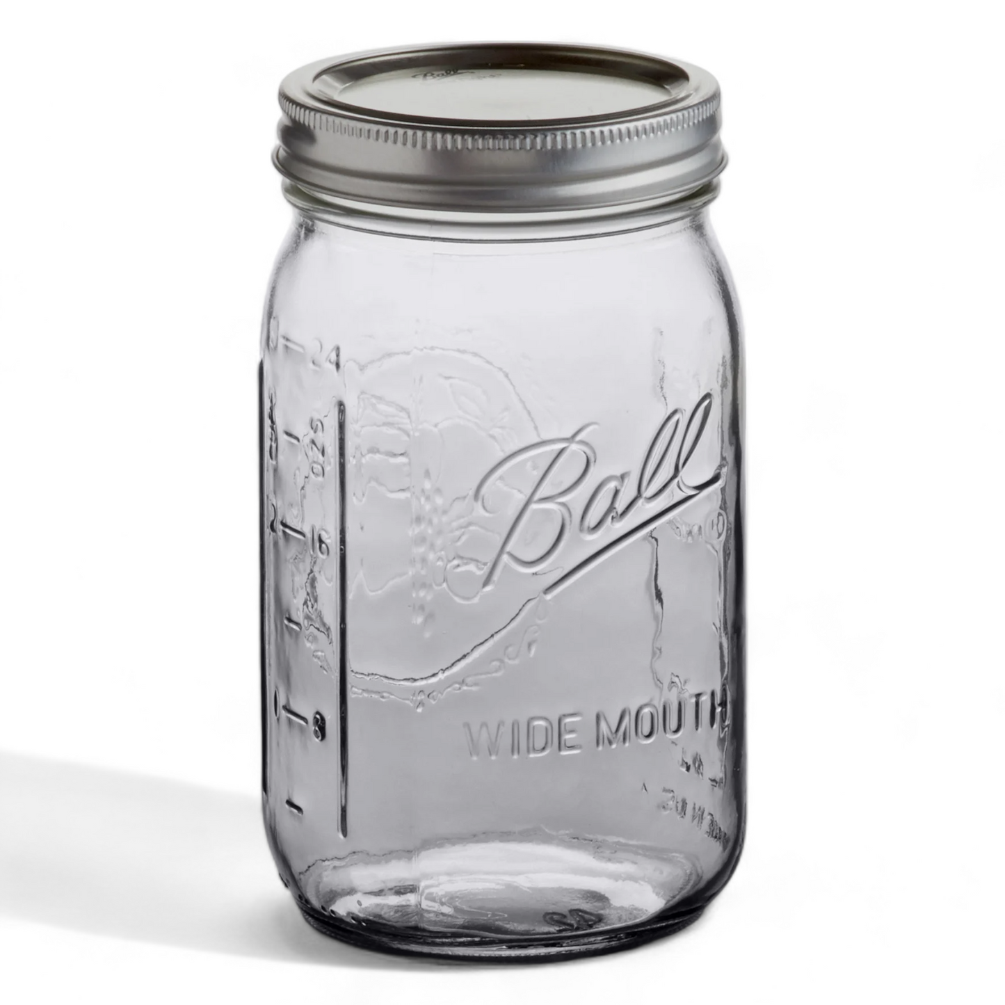 A large Ball mason jar with a metal lid and measuring levels showing