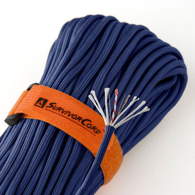 Detail of ACU royal-blue SurvivorCord with cord construction exposed and visible identification tags