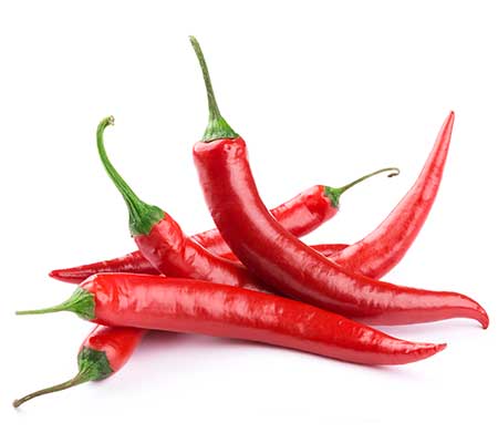 Group of four fully grown Heirloom Cayenne Long Red peppers