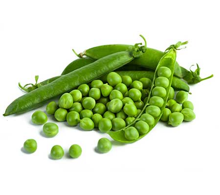 Fully grown pods of 'Green Arrow' pea seeds on a white surface