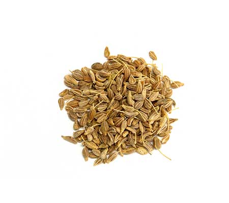 A heap of anise seeds on a white surface