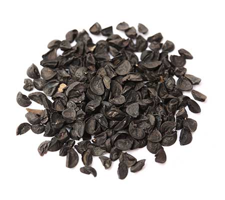 Close-up of a pile of Common Chives Heirloom Seeds against a white background