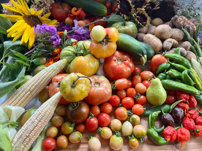Multiple vegetables and fruits freshly harvested on a table