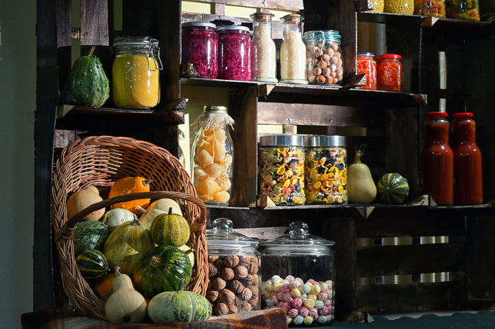 A pantry stocked with food in mason jars