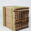 Multiple wooden trays for mason bees secured with green tape
