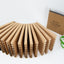 Stack of wooden mason bee trays unbound by green rubber bands