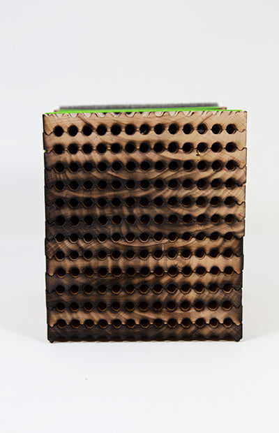 Front view of large wooden leafcutter bee tray with 6mm holes