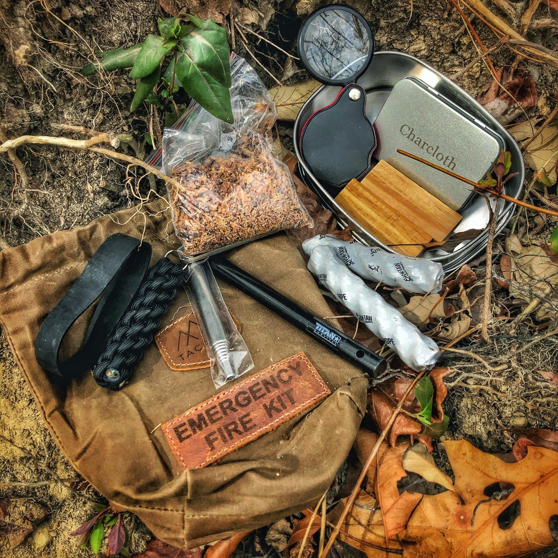 TACAMO fire kit contents including a knife and matches in a carry bag