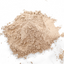 Close-up of Azomite mineral powder heap on a white backdrop