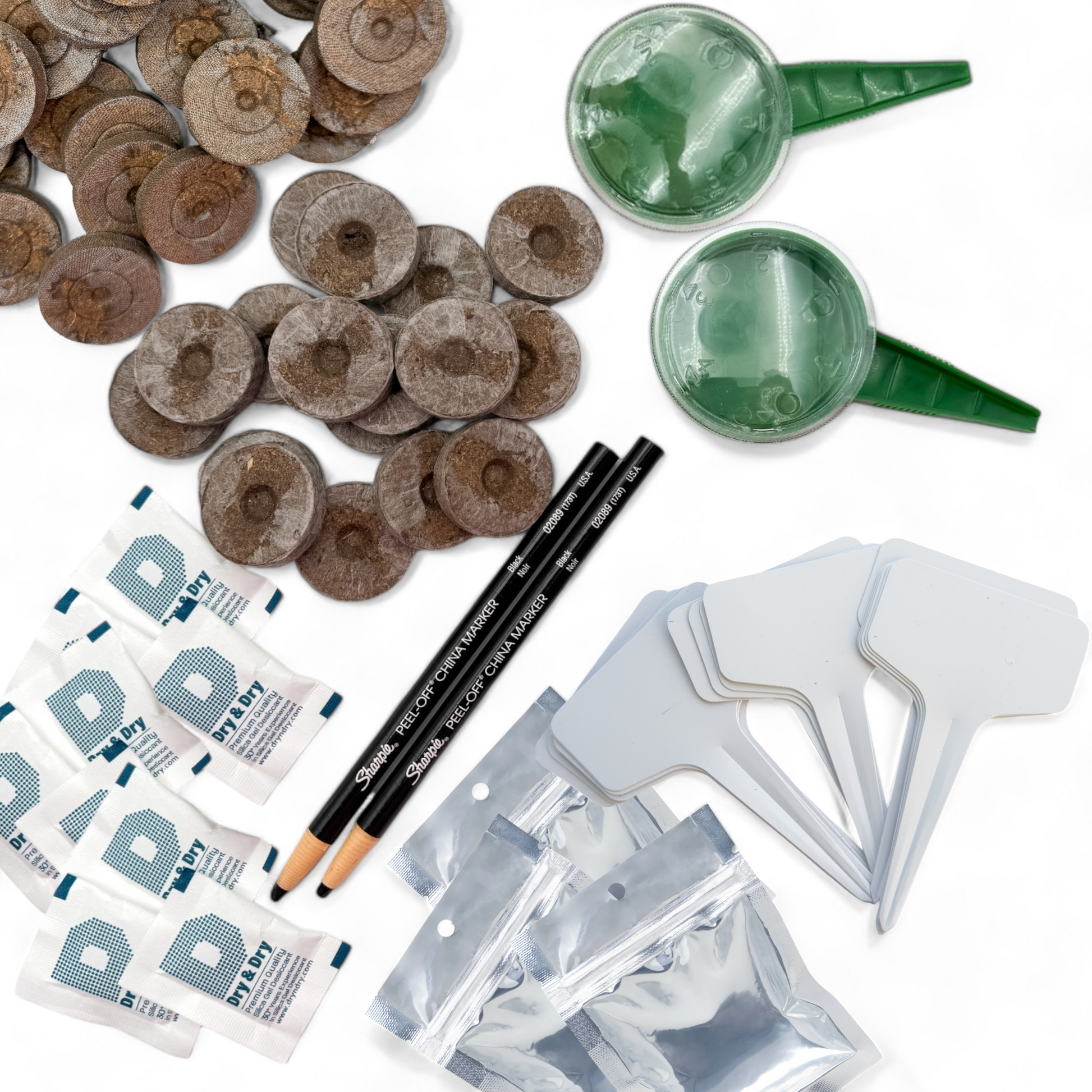 Complete garden starter kit displayed on a white backdrop with tools, seeds, and planting