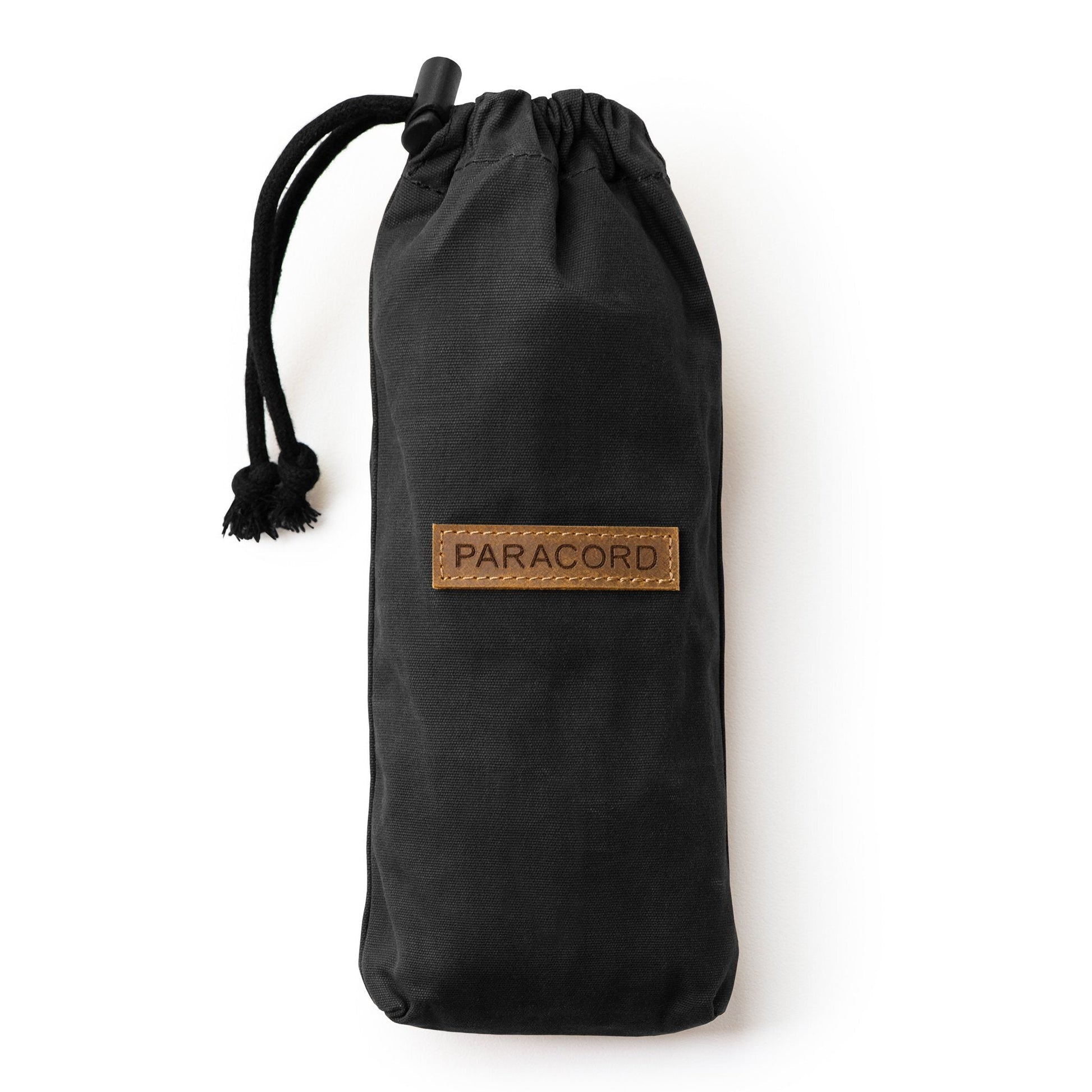 Black Canvas Bushcraft Bag with a clearly visible brand label
