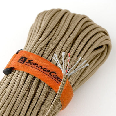 Detail of ACU desert tan SurvivorCord with cord construction exposed and visible identification tags