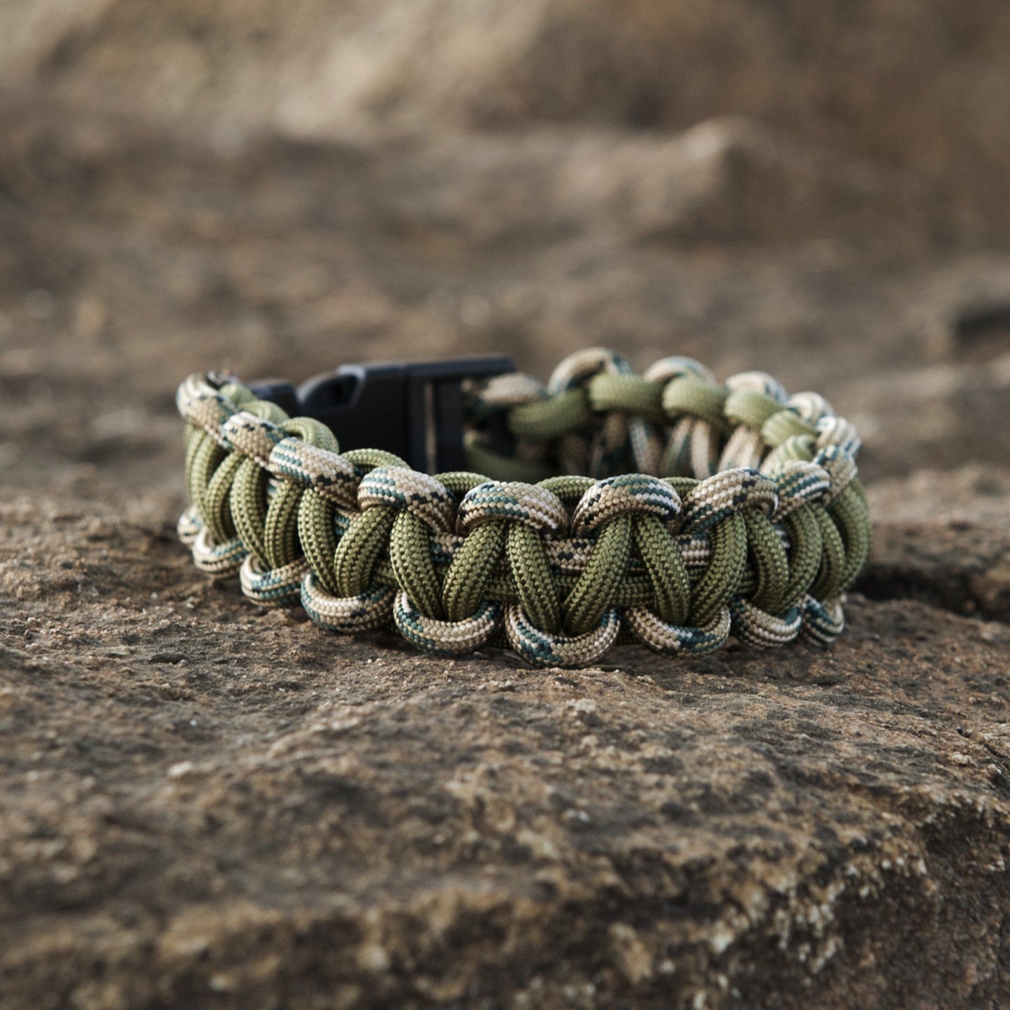 Close-up of forest green SurvivorCord showcasing the intertwined fibers in a wristband construction