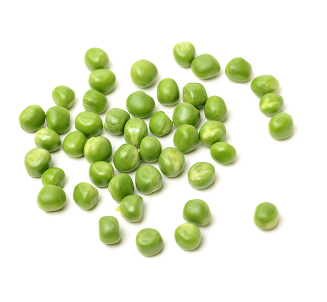 Pile of 'Little Marvel' pea seeds on a white surface